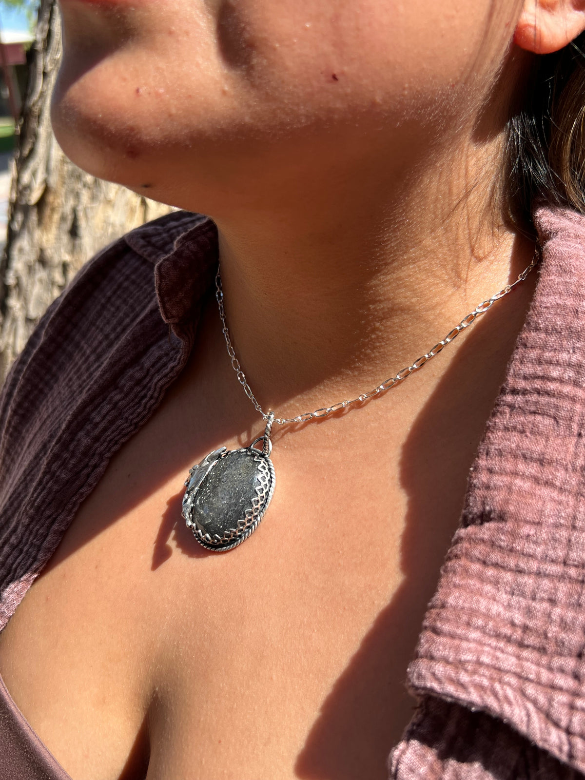 Black sunstone dragon pendant.