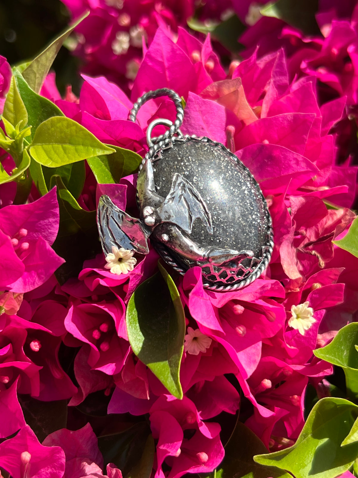 Black sunstone dragon pendant.