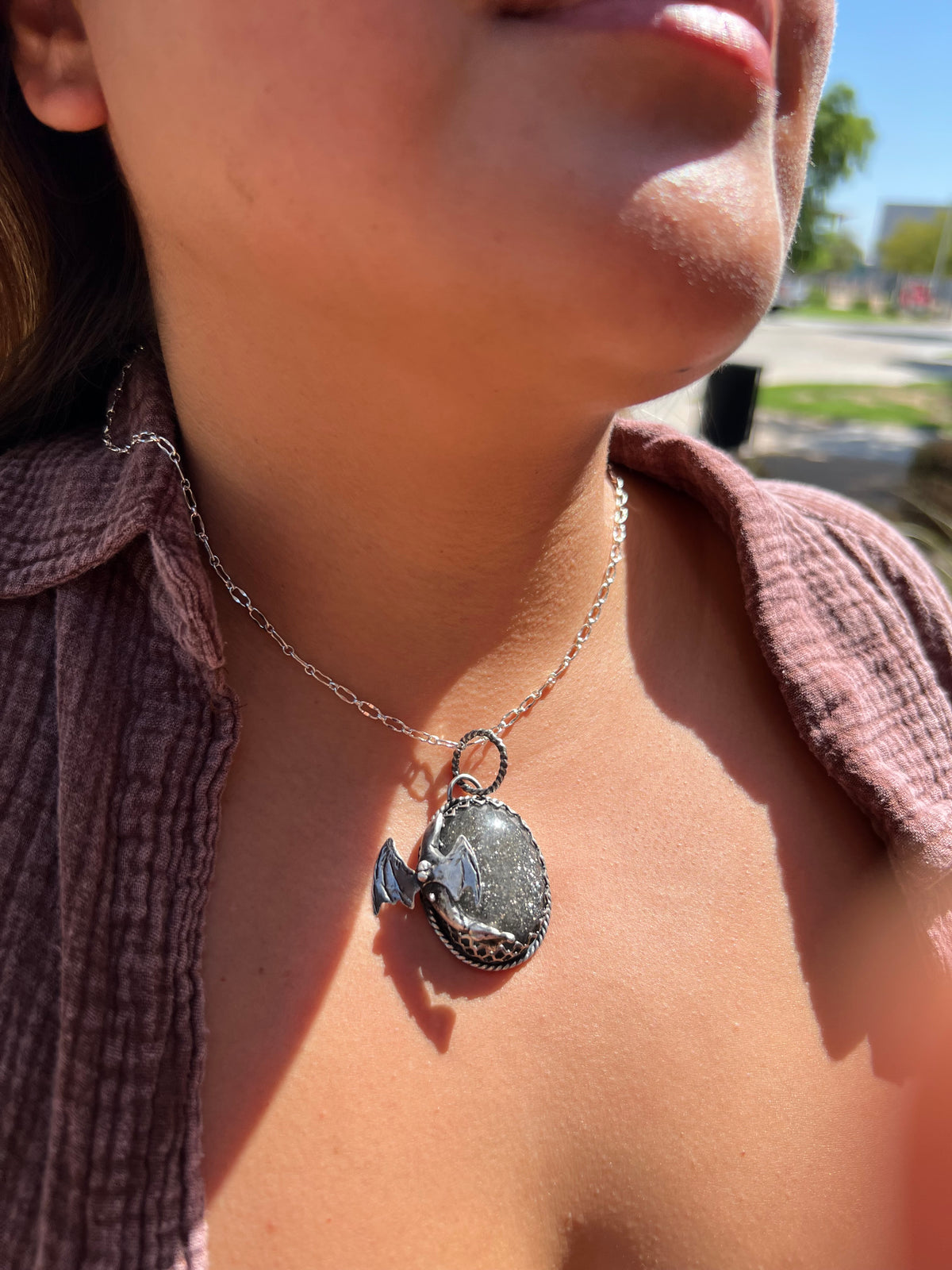 Black sunstone dragon pendant.