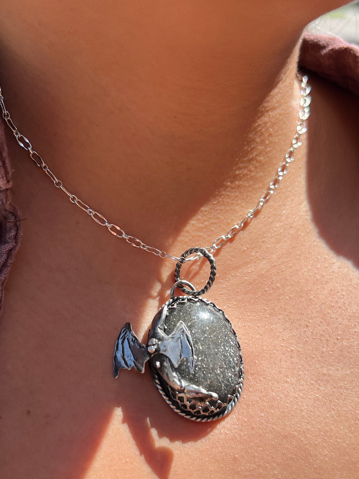 Black sunstone dragon pendant.