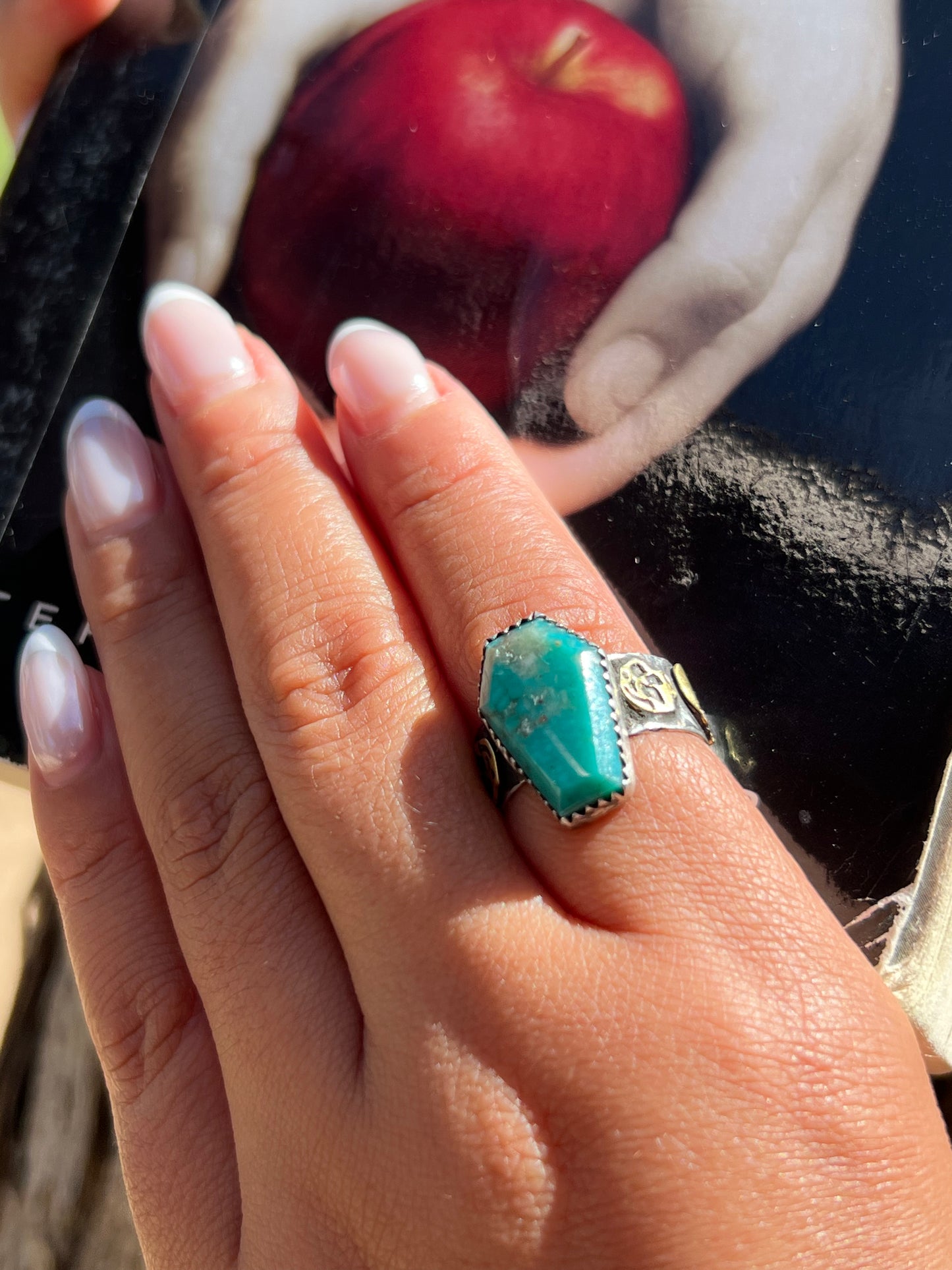 Turquoise ring with brass skulls 9 1/4 in