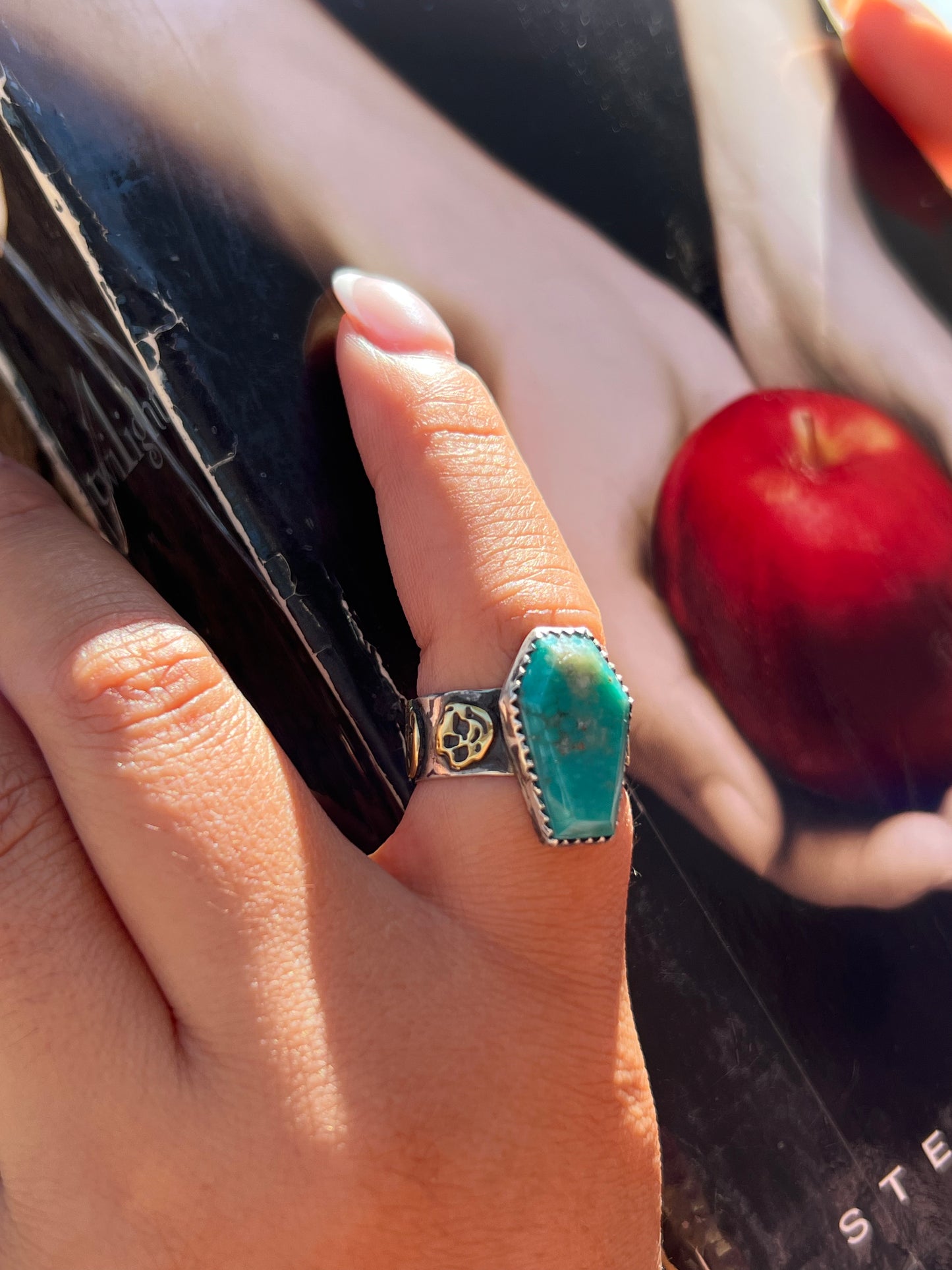 Turquoise ring with brass skulls 9 1/4 in